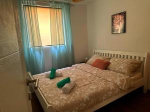 a bedroom with a bed with towels on it at Apartman EDEN in Jajce