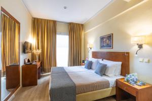 Ein Bett oder Betten in einem Zimmer der Unterkunft Hotel Marina
