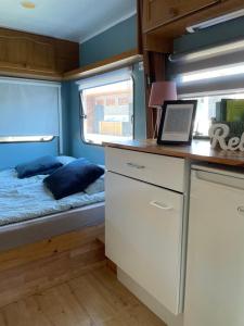 a small room with a bed and a window at Sonata Camp in Jastarnia +192 photos