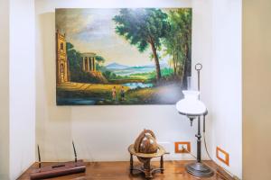 a painting hanging on a wall in a room at Hotel Il Convento in Naples