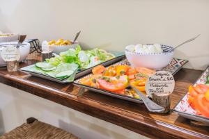 a buffet with plates of food on a table at Hotel Il Convento in Naples