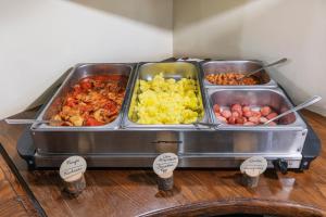 a buffet of different types of food on a table at Hotel Il Convento in Naples