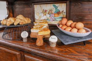 a counter with eggs and bread and a bowl of bread at Hotel Il Convento in Naples