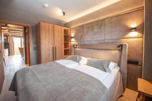 Ένα ή περισσότερα κρεβάτια σε δωμάτιο στο Filzsteinresort Wohnungen Top 8
