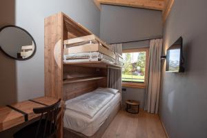 Postel nebo postele na pokoji v ubytování Filzsteinresort Wohnungen Top 11