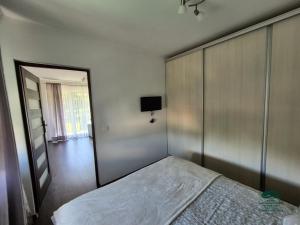 Posteľ alebo postele v izbe v ubytovaní Apartamenty Maria