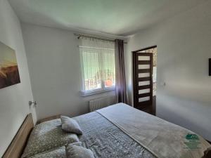 Posteľ alebo postele v izbe v ubytovaní Apartamenty Maria