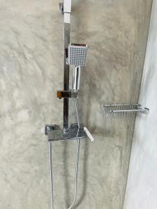 a shower in a bathroom with a shower at Cozy Homestay in Ella