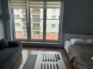 Postel nebo postele na pokoji v ubytování Apartament we Władysławowie