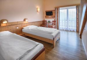 Rúm í herbergi á JUFA Hotel Gitschtal