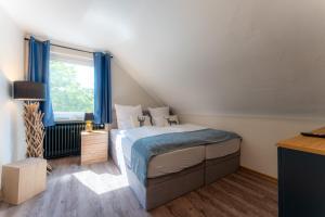 Postel nebo postele na pokoji v ubytování Gasthof Neuhaus
