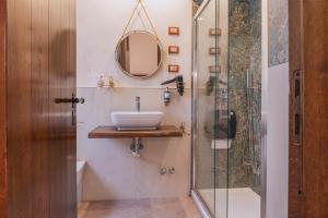 a bathroom with a sink and a shower at Hotel Il Convento in Naples