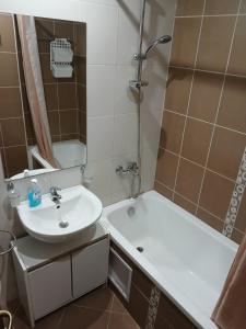 a bathroom with a sink and a shower at Golden Hacienda in Sozopol