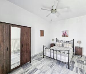 Postel nebo postele na pokoji v ubytování Tinoshomelidays Residences