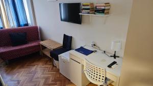 TV a/nebo společenská místnost v ubytování Napol-In