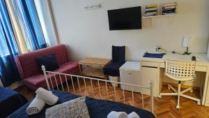TV a/nebo společenská místnost v ubytování Napol-In