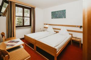 Posteľ alebo postele v izbe v ubytovaní Hotel Kernwirt