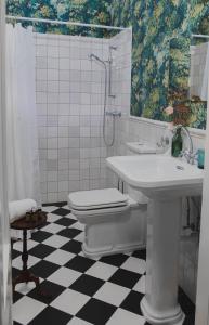 a white bathroom with a sink and a toilet at Villa Porcelaine in Keszthely +20 photos