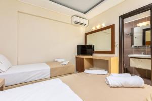 Voodi või voodid majutusasutuse Esperia Hotel toas