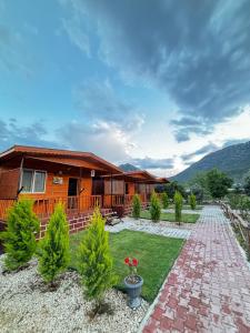 a house with a brick path in front of it at Adrasan yeşim apart evleri in Kumluca
