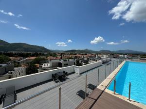 a view from the roof of a building with a swimming pool at Epicenter Suite in Trebinje