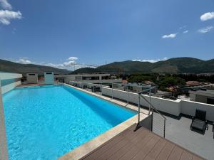a swimming pool on the roof of a building at Epicenter Suite in Trebinje
