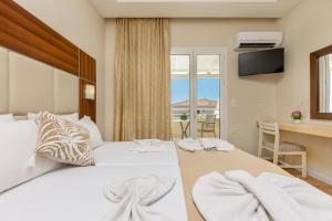 Voodi või voodid majutusasutuse Esperia Hotel toas