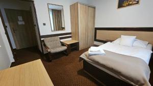 Voodi või voodid majutusasutuse Hotel Adler toas