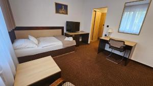 Voodi või voodid majutusasutuse Hotel Adler toas
