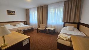 Voodi või voodid majutusasutuse Hotel Adler toas