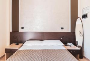 Postel nebo postele na pokoji v ubytování Hotel Gabrini