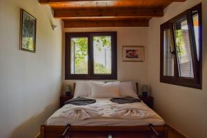Postel nebo postele na pokoji v ubytování Mylonakis Home