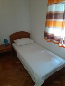 Postel nebo postele na pokoji v ubytování NIVES B.