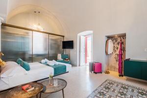 a hotel room with a bed and a table at Imperial Paradise in Monopoli