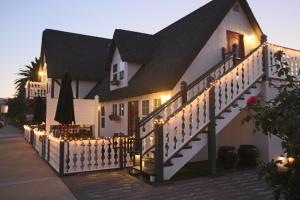 a house with a staircase with lights on it at New Haven Inn in Solvang