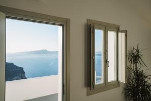 a window in a room with a view of the ocean at Santonero in Akrotiri