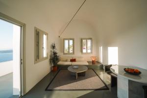 a living room with a couch and a table at Santonero in Akrotiri