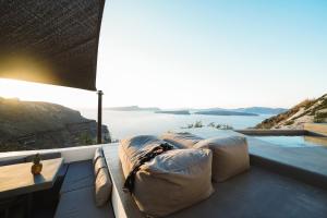 a view of the ocean from a house with pillows at Santonero in Akrotiri