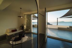 a living room with a view of the ocean at Santonero in Akrotiri