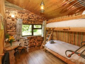 En eller flere senge i et værelse på Stag Lodge Holiday Retreat