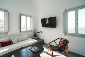 a living room with a couch and a table at Santonero in Akrotiri