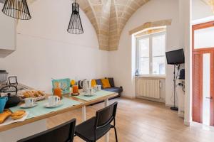 a living room with a table with food on it at Al Duomo in Brindisi