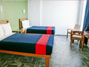 Postel nebo postele na pokoji v ubytování Hotel Soberanis