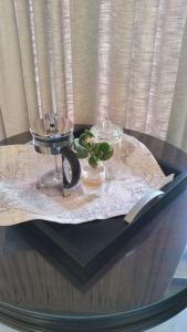 a table with a glass tray with a plant on it at Jackal Buzzard Mountain Guesthouse in Hillsowen +46 photos