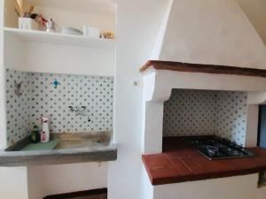 a kitchen with an oven with a counter top at Portoferraio Old City Studio in Portoferraio +2 photos