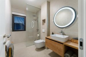 a bathroom with a sink and a mirror at D Marine villa in Bibinje +18 photos