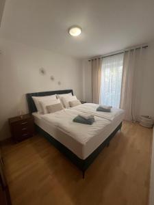 Postel nebo postele na pokoji v ubytování Apartment H&A