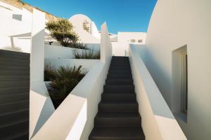 a staircase leading up to a house with white walls at Santonero in Akrotiri