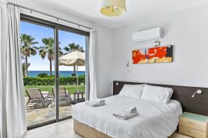 Postel nebo postele na pokoji v ubytování Platzia Beach Villas