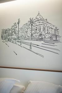 a drawing of a building on a wall at Hotel du Pin Nice Port by Soniho in Nice +74 photos
